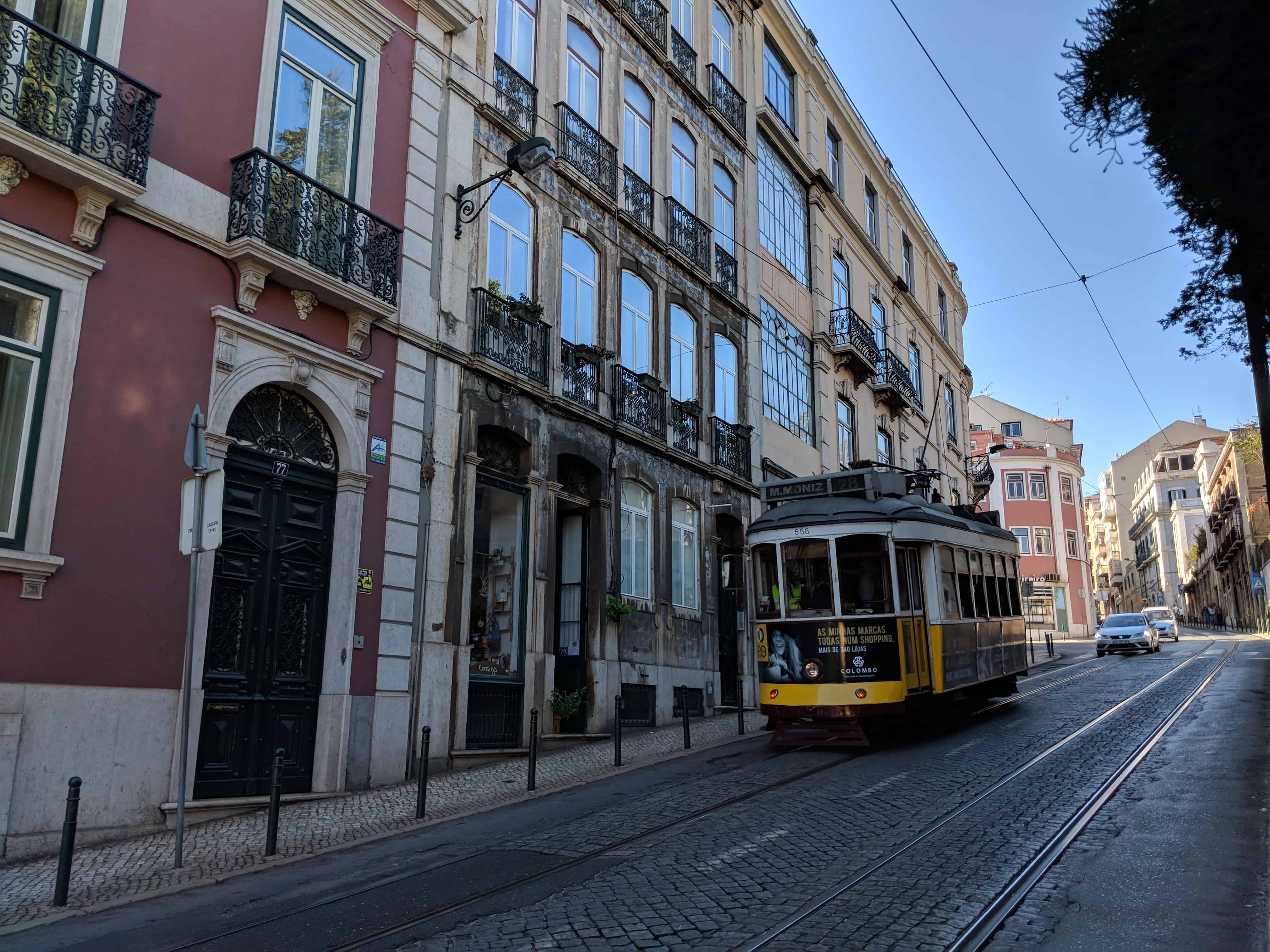 Trans driving down a cobbled city street