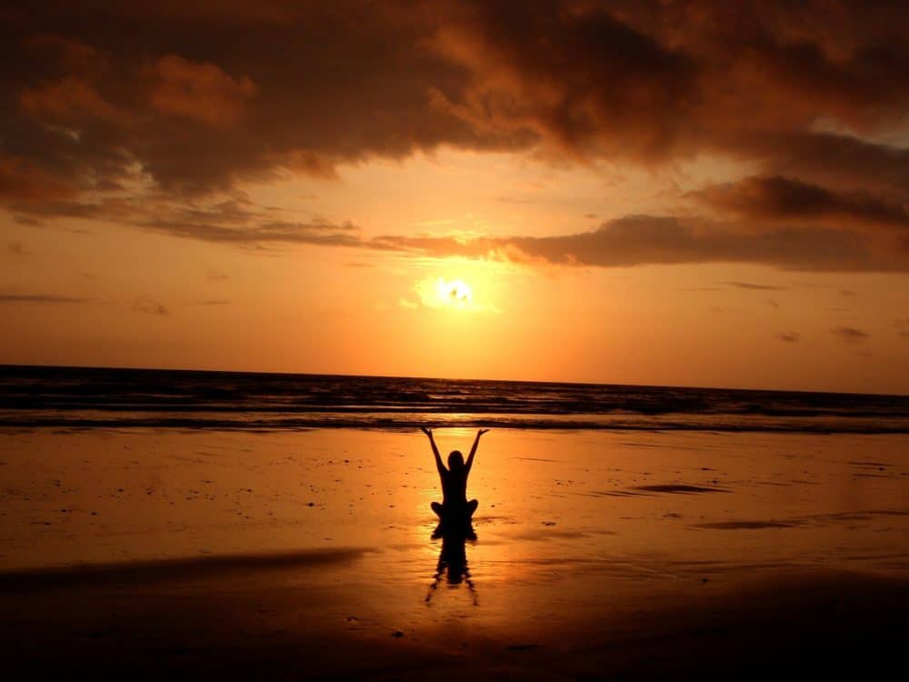 Beach sunset yoga meditation