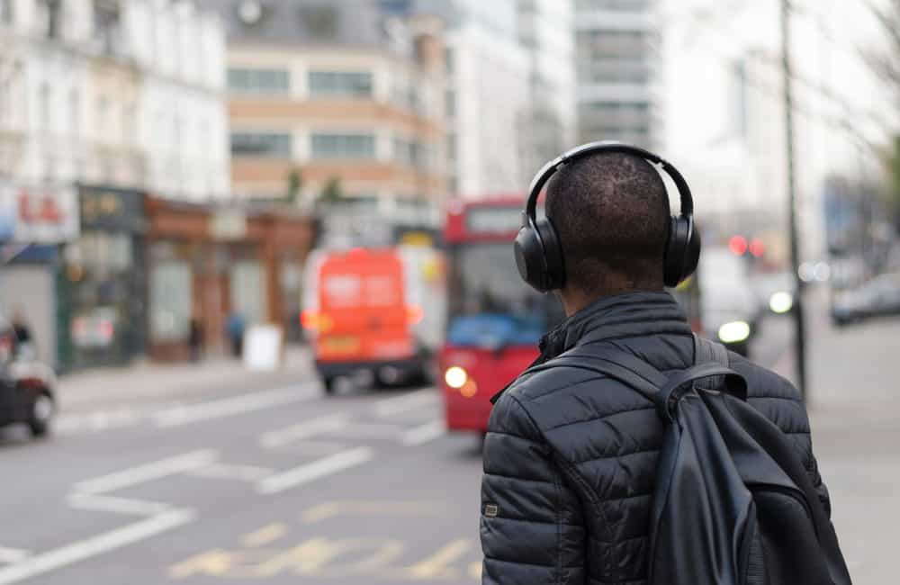 Man wearing headphones on city street