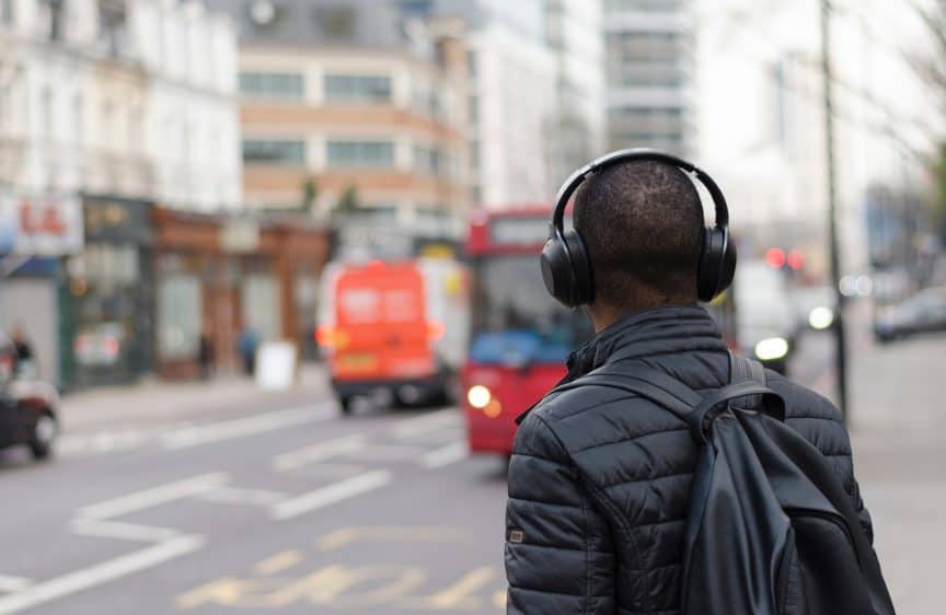 Man wearing headphones on city street