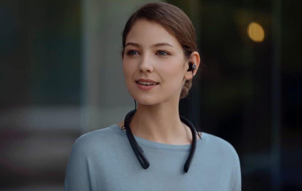 Women wearing Life NC headphones