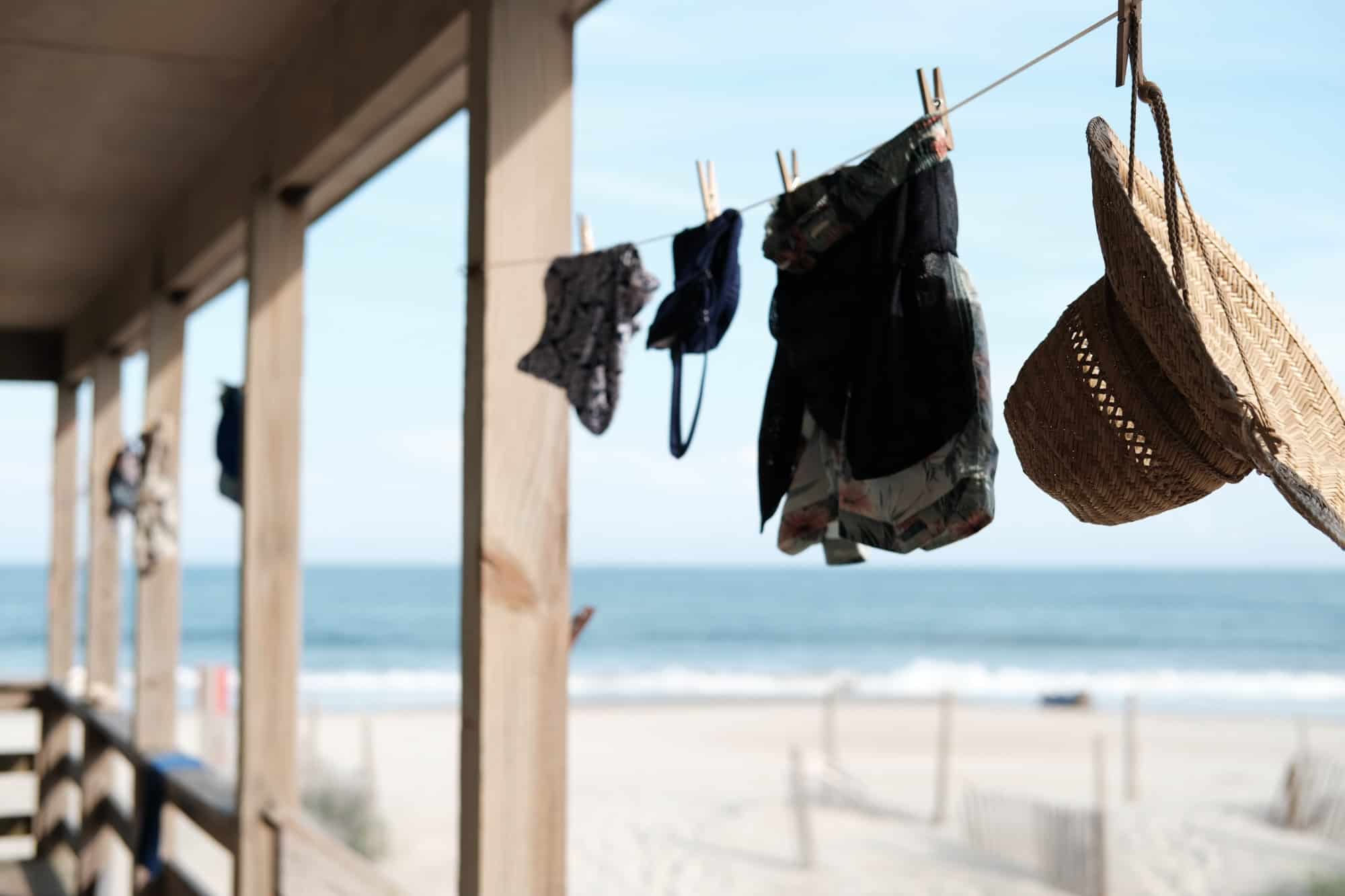 Clothes hanging on washing line near beach