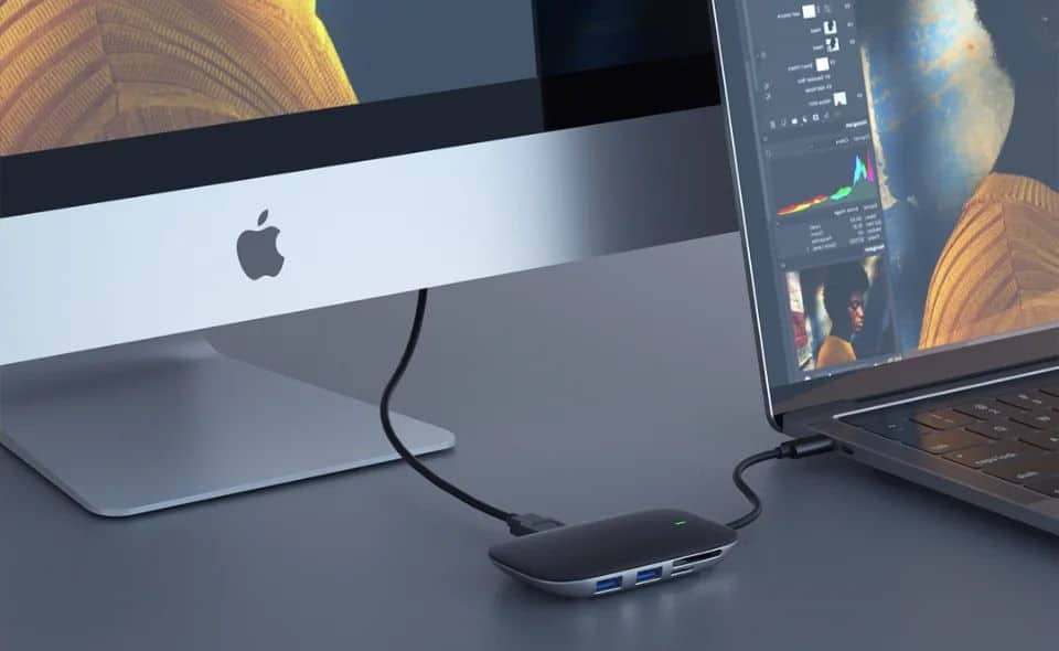 Aukey Unity Link PD II USB-C Hub attached to an Apple monitor and laptop.