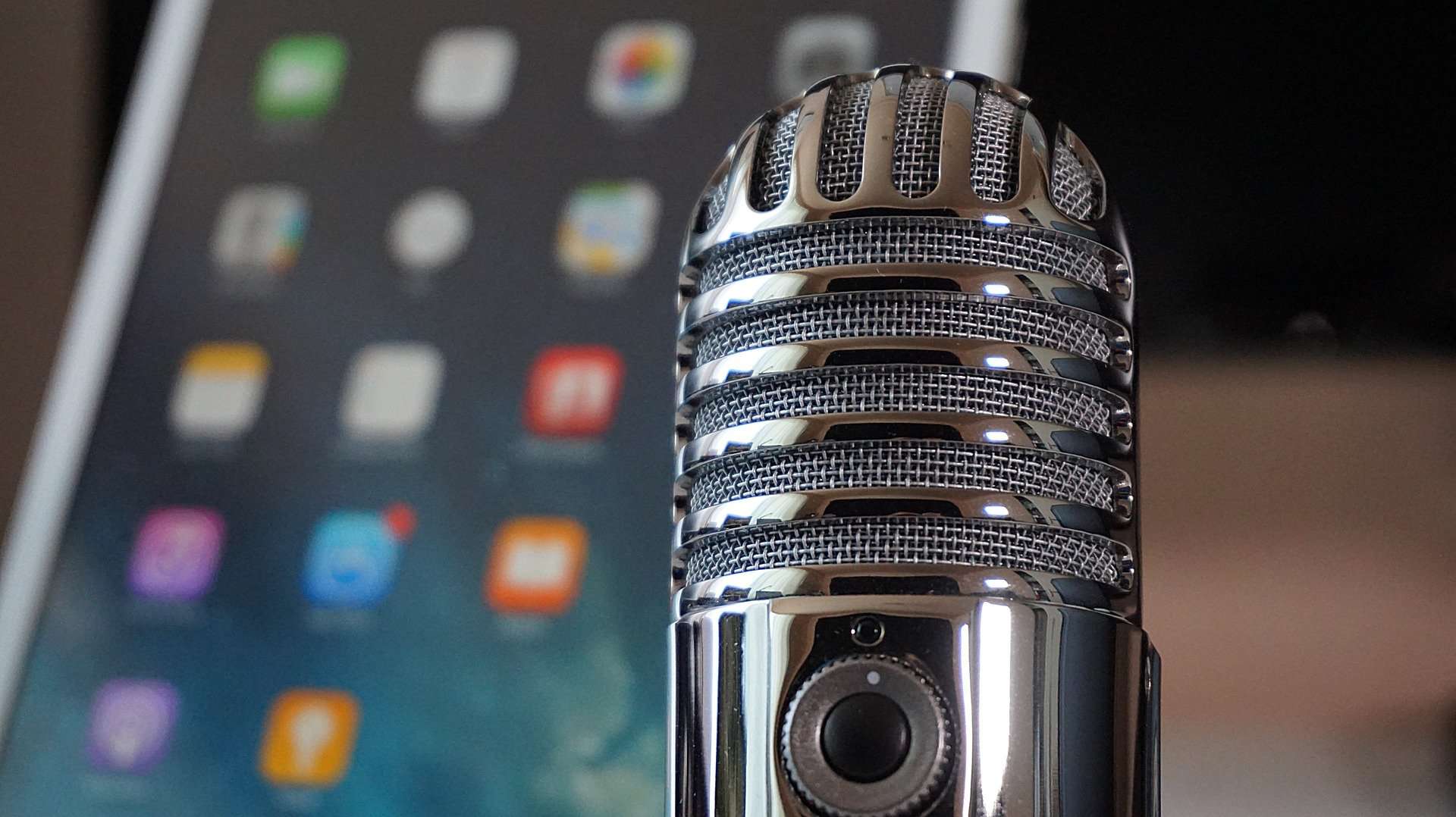 Microphone with tablet in the background
