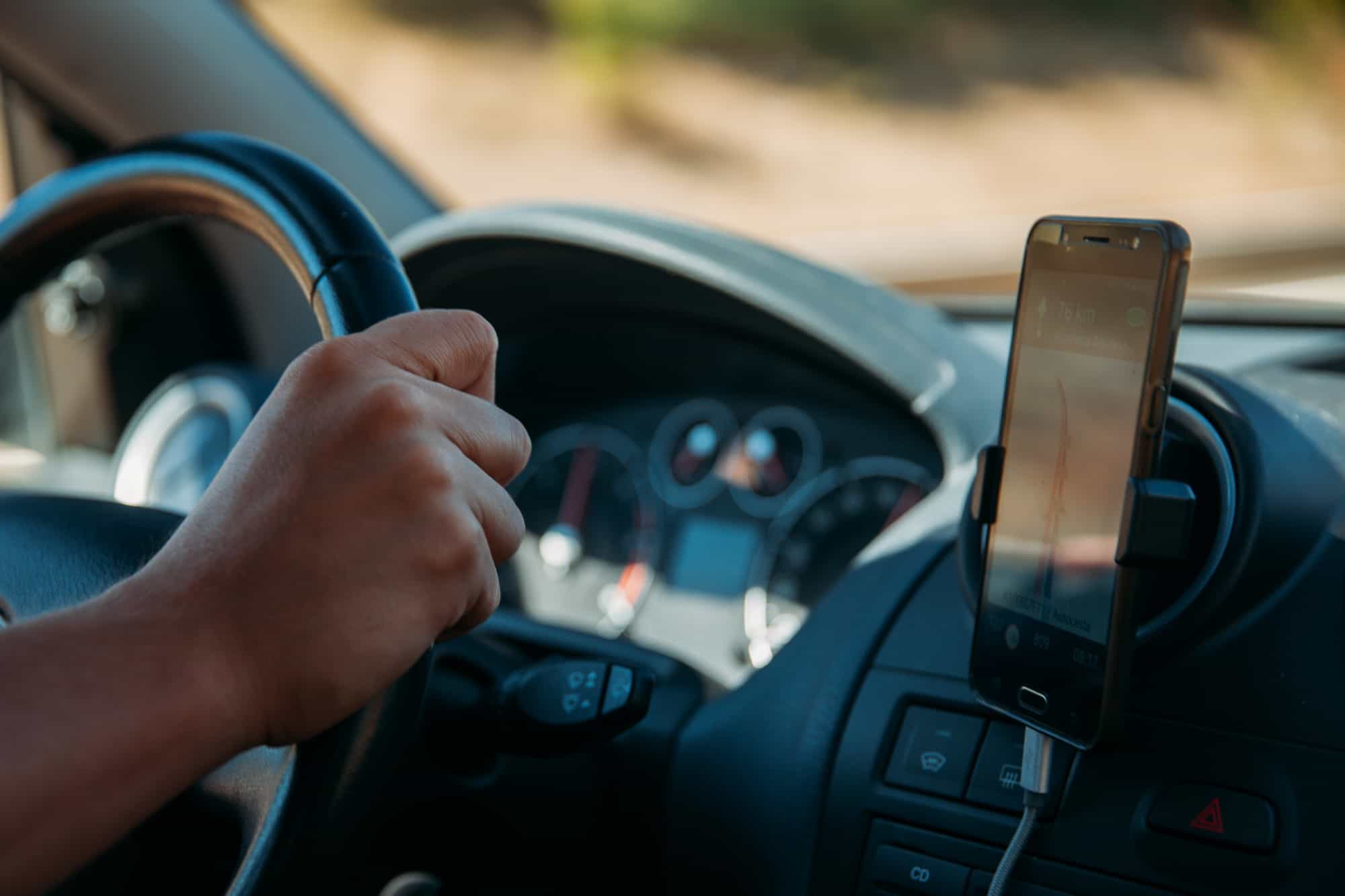 Smartphone mounted in car phone holder