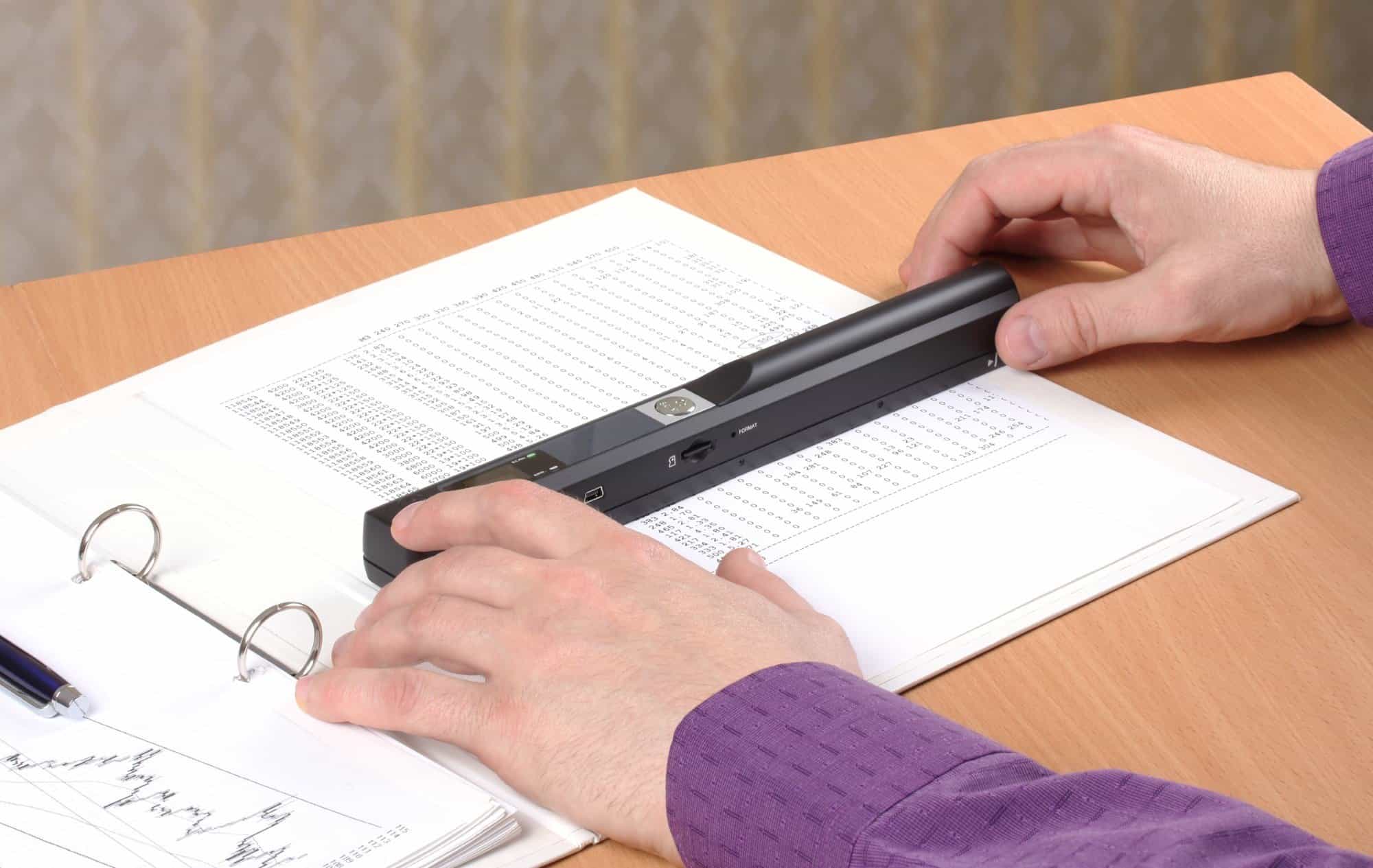 Person using portable scanner