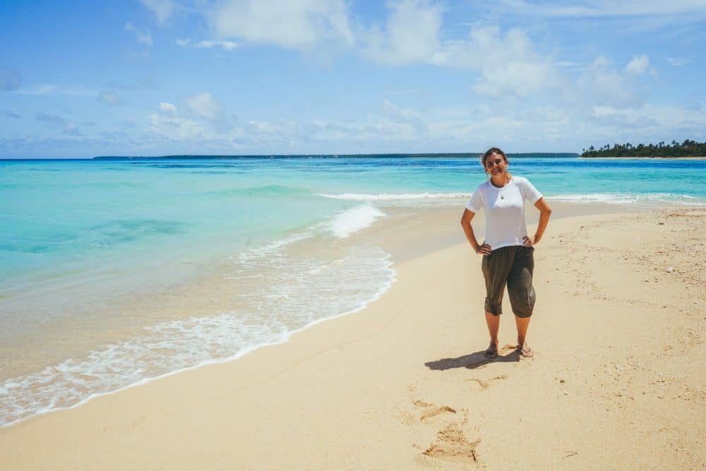 Lauren standing on a sandy beach