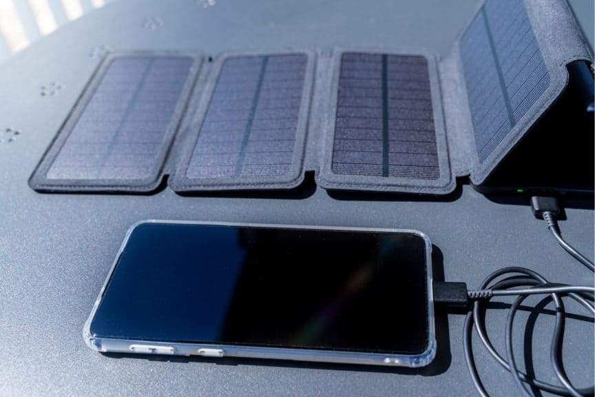 Solar power bank charging a phone
