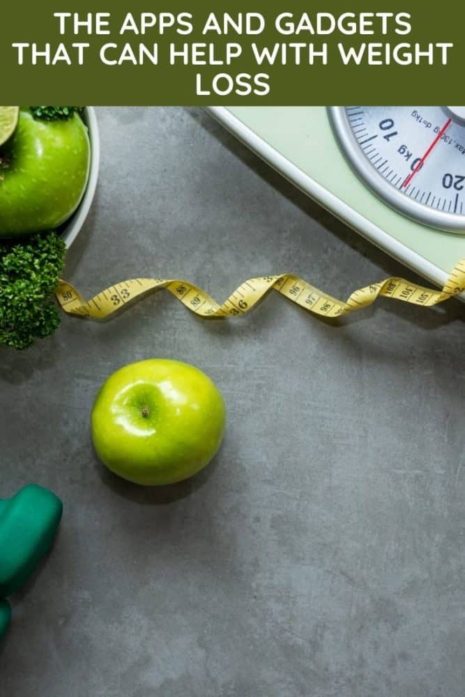 Scales, healthy food, weights, and a tape measure, with text "The Apps and Gadgets That Can Help With Weight Loss" above