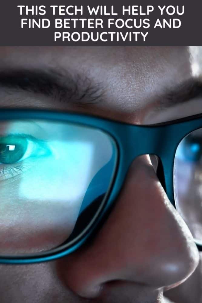 Closeup of man with computer screen reflecting in glasses, with text "This Tech Will Help You Find Better Focus and Productivity" above
