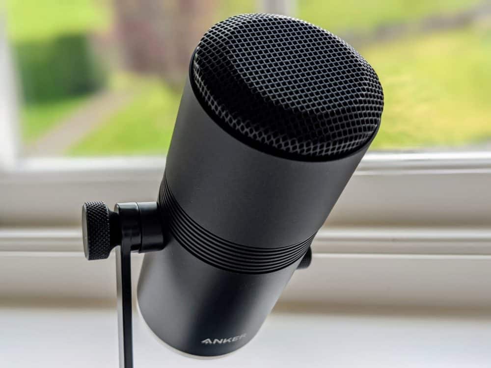 Closeup of Anker M300 USB microphone sitting on window ledge