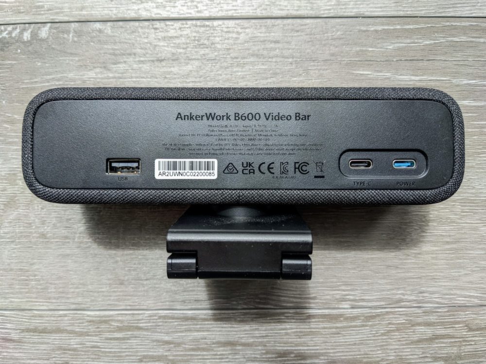 Closeup of back of AnkerWork B600 video bar on wood-grained floor