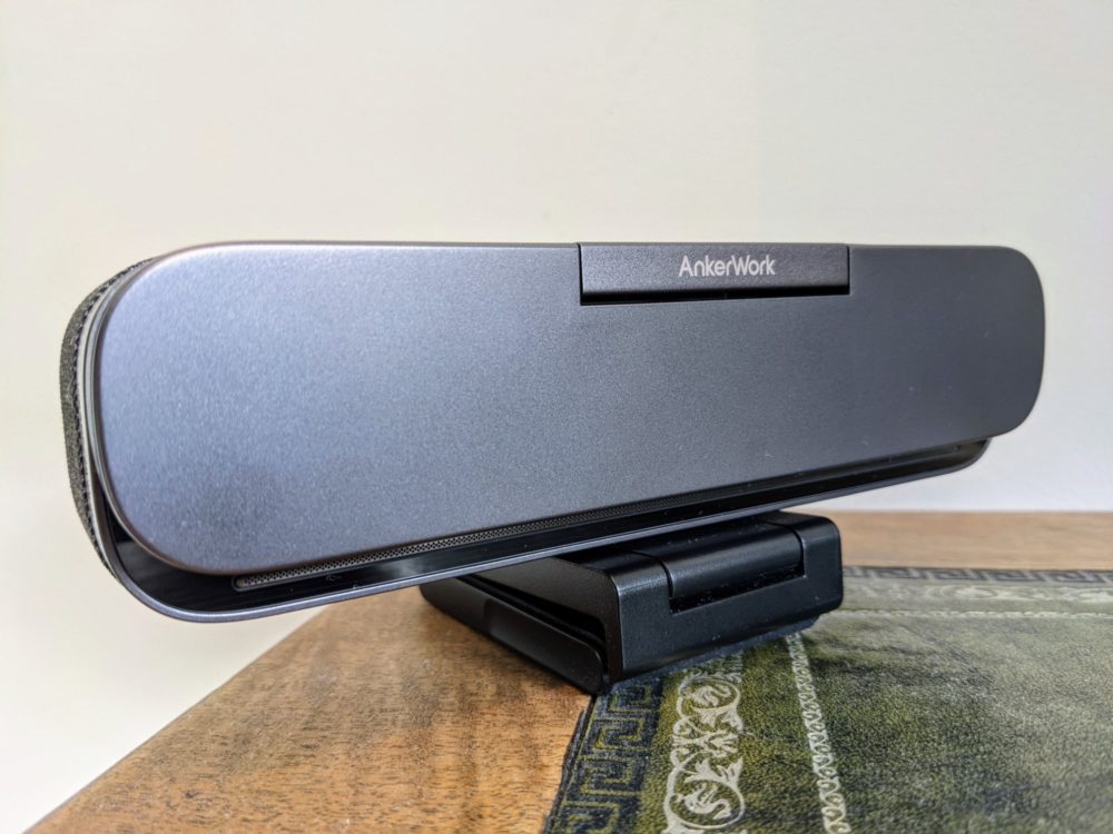 Closeup of front of AnkerWork B600 video bar sitting on corner of desk