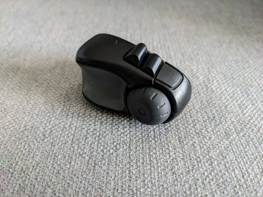 Side-on view of Swiftpoint ProPoint mouse sitting on plain fabric