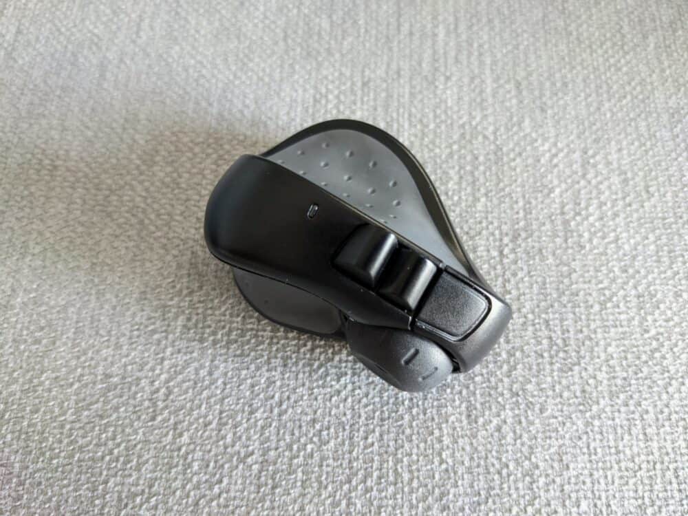 Top-down view of Swiftpoint ProPoint mouse sitting on plain fabric