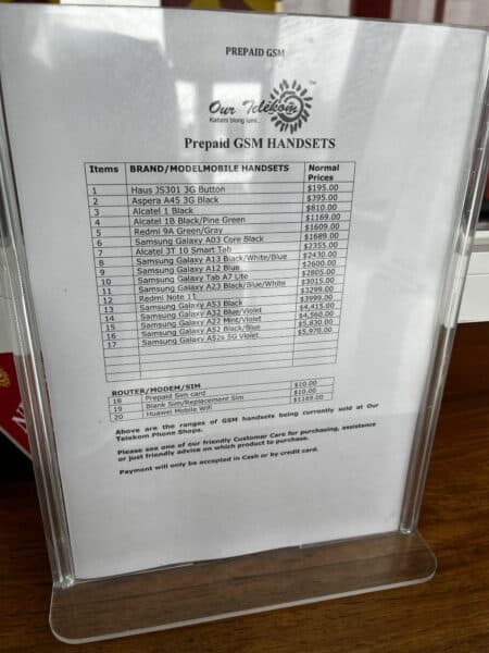 Price list for phones and SIM cards displayed at Our Telekom store in Solomon Islands
