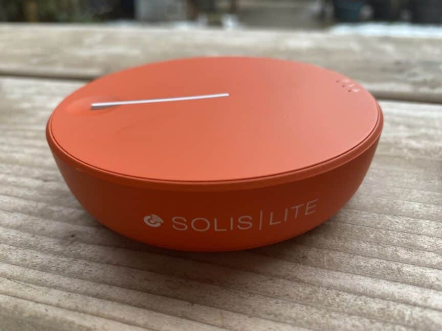 Solis Lite mobile hotspot sitting on outdoor wooden table