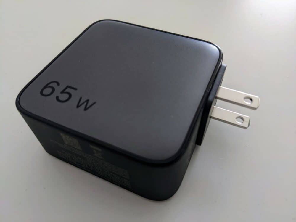 UGreen 65W travel charger on white table