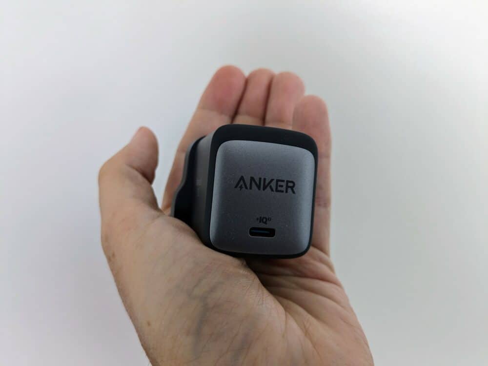 Anker 715 Nano 2 charger being held in hand, with a white background