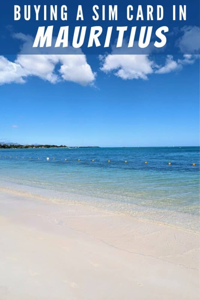 Beach and ocean in Mauritius, with small swimming buoys visible in foreground and a few puffy white clouds in blue sky. Text "Buying a SIM Card in Mauritius" overlaid at top