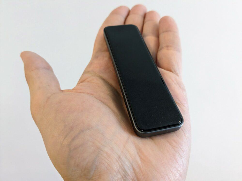Small, slim portable SSD sitting in upturned palm