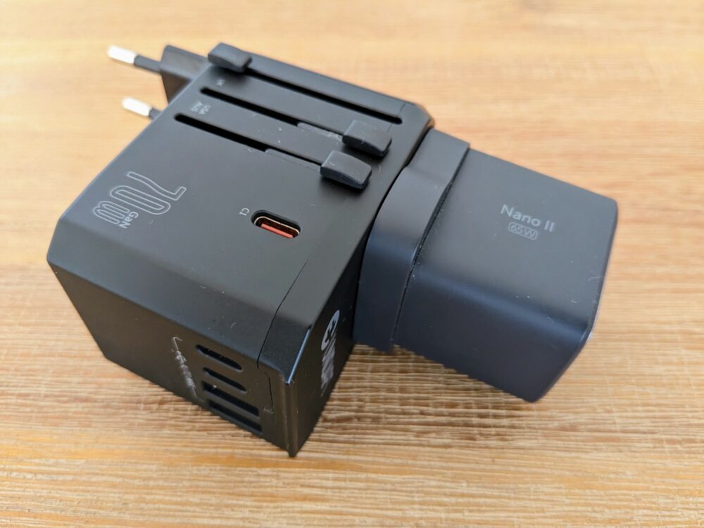 Undapt 70W travel adapter with Anker Nano II charger on wooden table