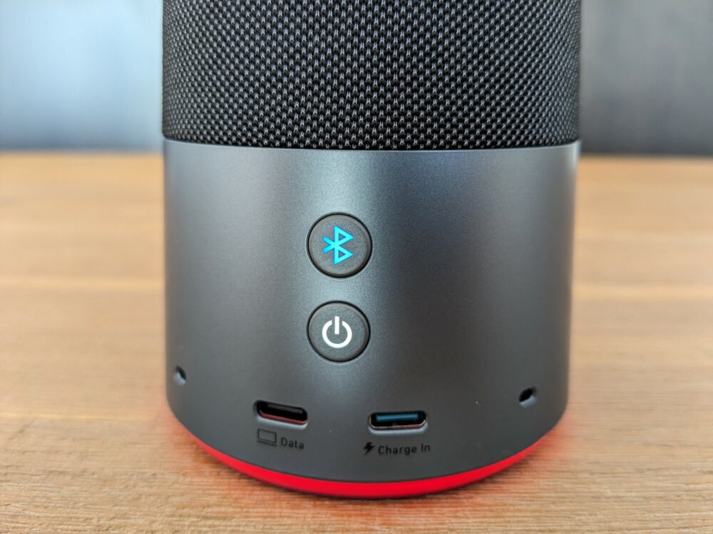 Closeup of the rear of the AnkerWork S600 speakerphone, showing the power button, Bluetooth button, two USB C ports, and two microphones