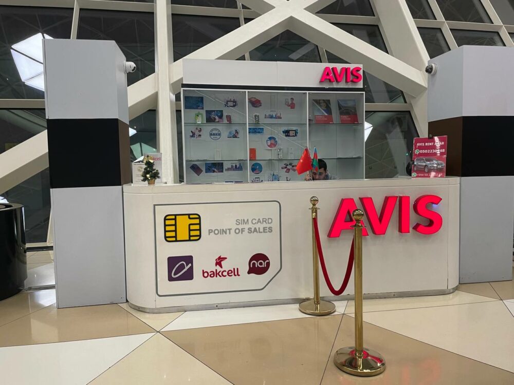 Small kiosk at an airport selling SIM cards and other items