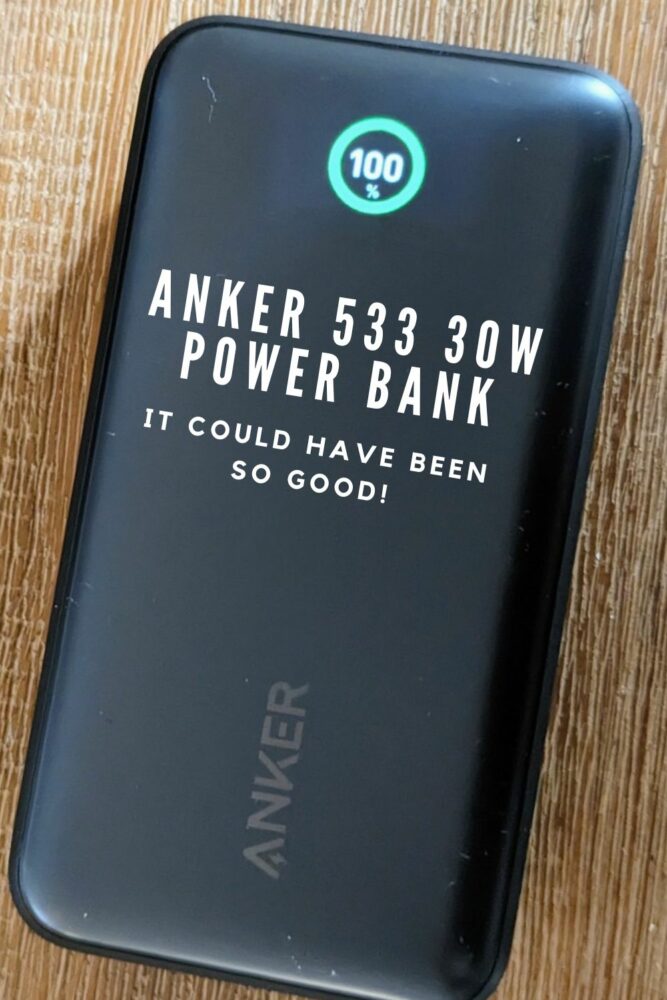 Anker power bank on a wooden table with text "Anker 533 30W Power Bank: It Could Have Been So Good!" overlaid on it